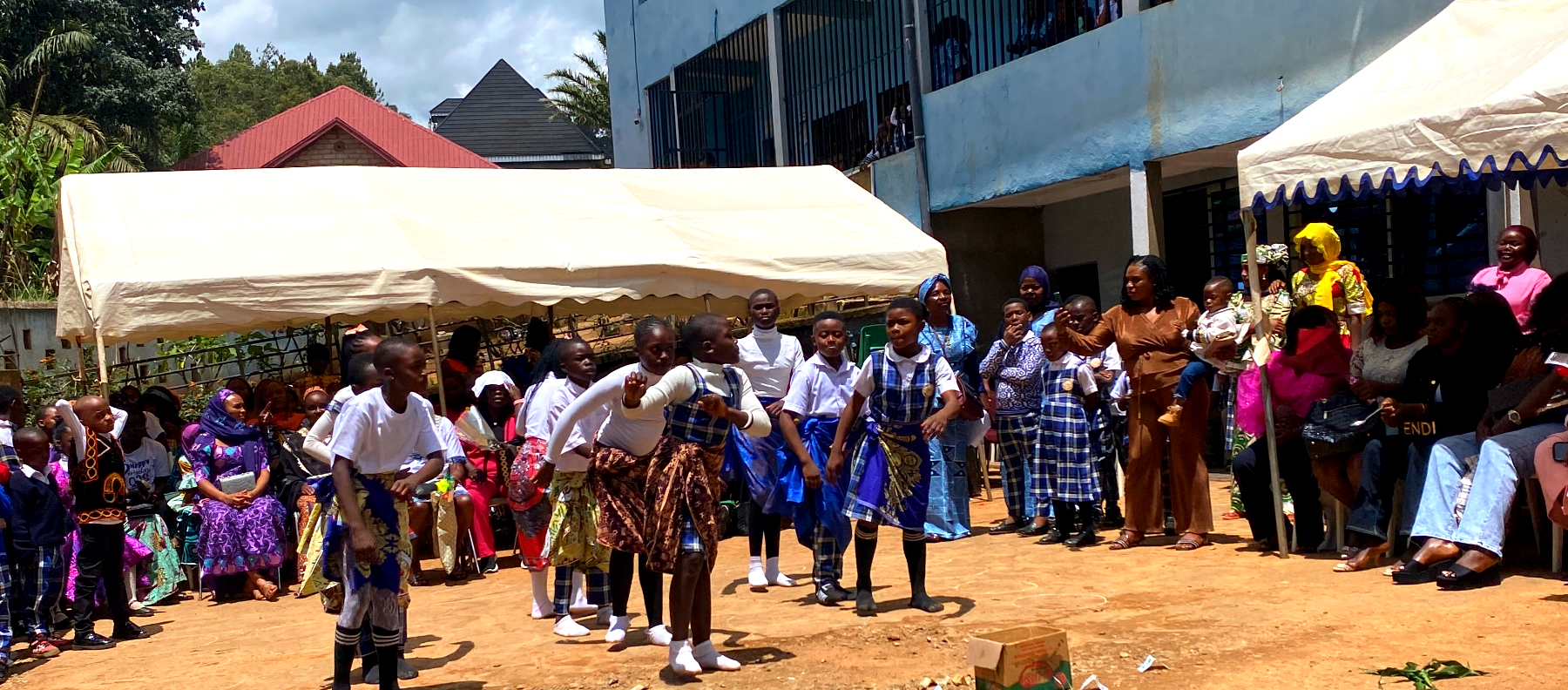 Pupils performing in the Benesther school yard, Bamenda Up Station